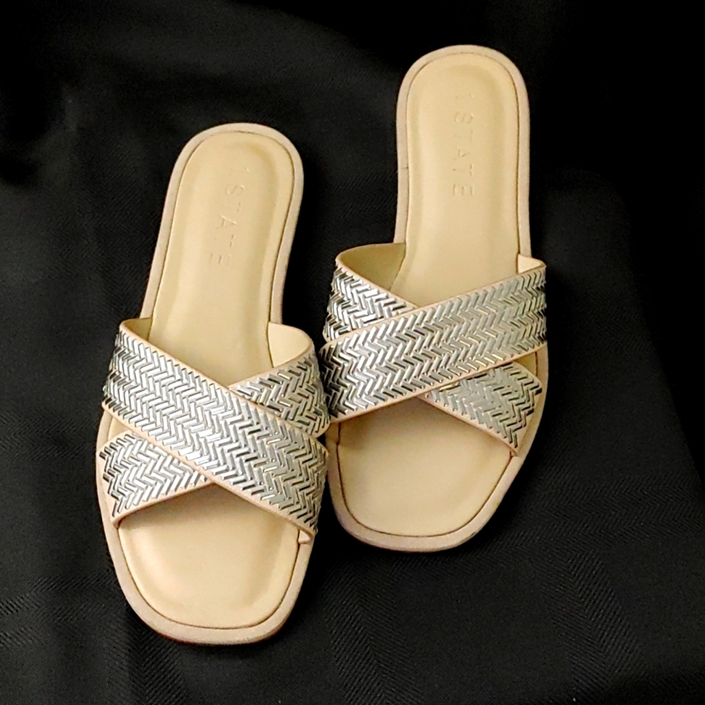 1. State 8.5 silver crisscrossed flip flop. Never worn.
